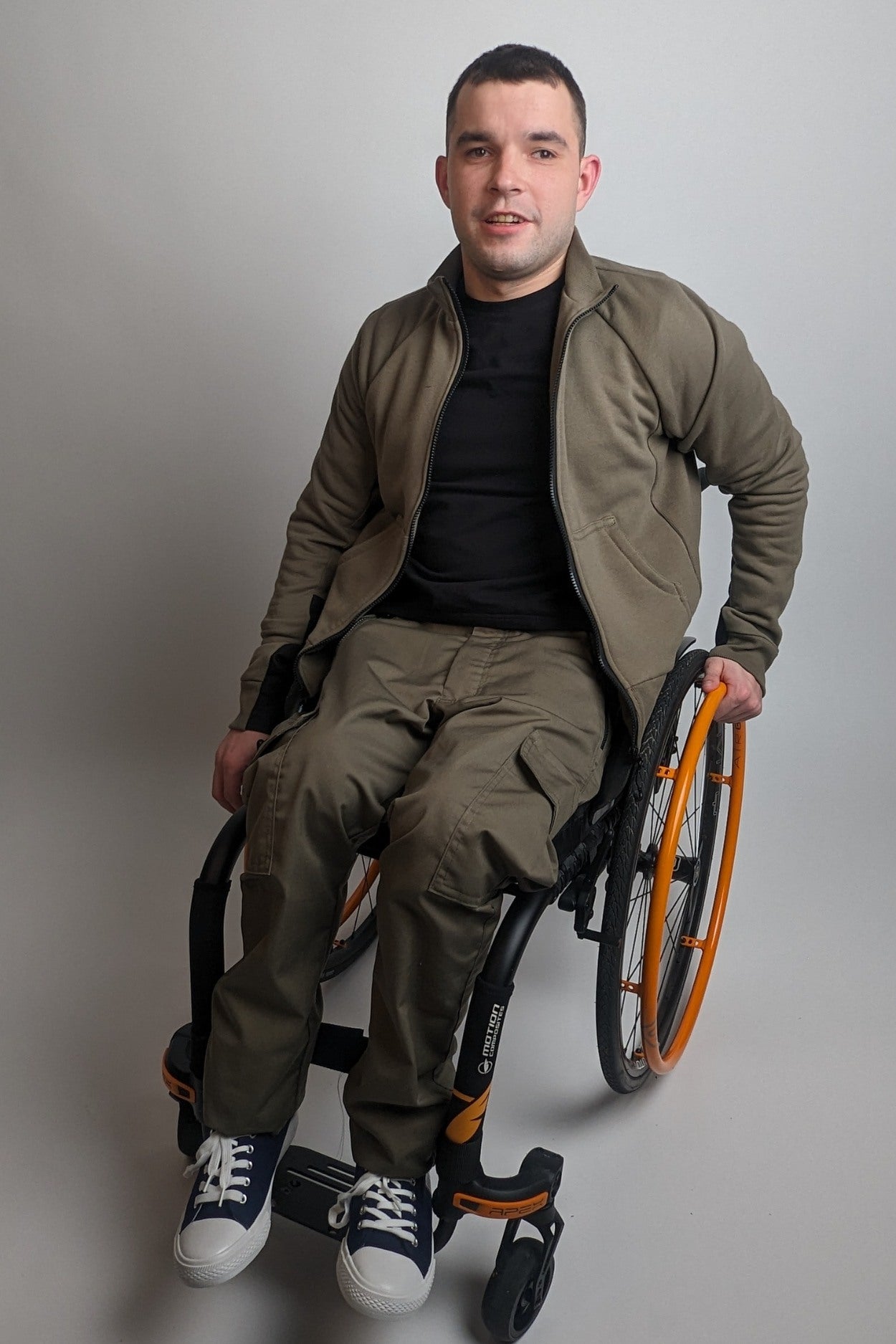 Wheelchair accessible adaptive sweatshirt jacket with magnetic closure and dirt resistant sleeves army green